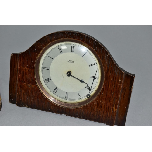 129 - AN EARLY 20TH CENTURY ASPREY 8 DAY TRAVEL CLOCK, in a damaged leather folding case, incomplete, toge... 