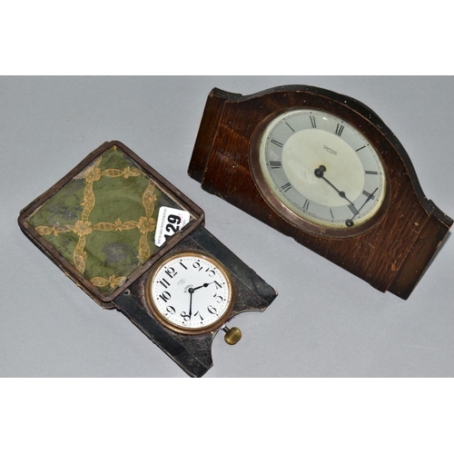 129 - AN EARLY 20TH CENTURY ASPREY 8 DAY TRAVEL CLOCK, in a damaged leather folding case, incomplete, toge... 