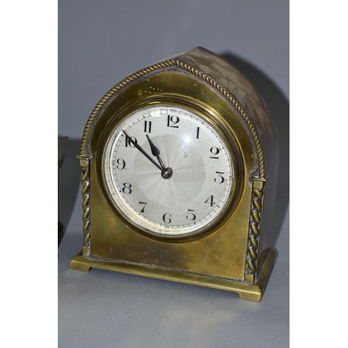 131 - TWO EARLY 20TH CENTURY BRASS CASED MANTEL CLOCKS, one domed, the other arched, both with Arabic nume... 