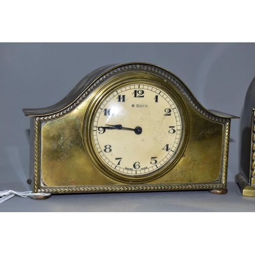 131 - TWO EARLY 20TH CENTURY BRASS CASED MANTEL CLOCKS, one domed, the other arched, both with Arabic nume... 