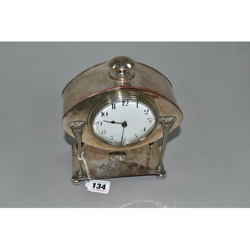 134 - AN ARTS AND CRAFTS HAND HAMMERED SILVER PLATE ON COPPER MANTEL CLOCK, possibly by A.E Jones, knob fi... 