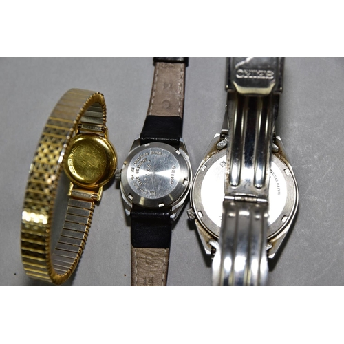 139 - THREE WRISTWATCHES, to include a Seiko automatic ref 7S26-3060, black dial with Arabic numerals, day... 