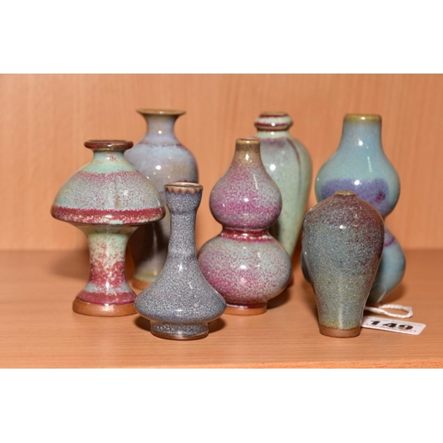 149 - SEVEN MINIATURE CHINESE STYLE VASES, shapes include baluster, double gourd and garlic mouth, mottled... 