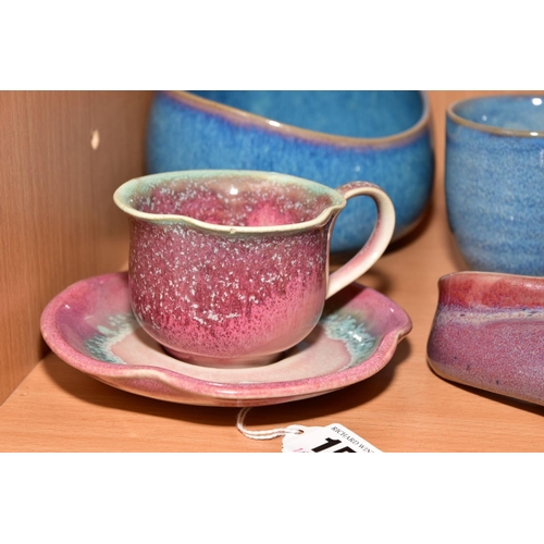 154 - EIGHT PIECES OF STUDIO POTTERY, comprising a tea cup and saucer, matching milk jug, wall pocket, bow... 