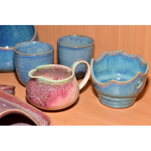 154 - EIGHT PIECES OF STUDIO POTTERY, comprising a tea cup and saucer, matching milk jug, wall pocket, bow... 