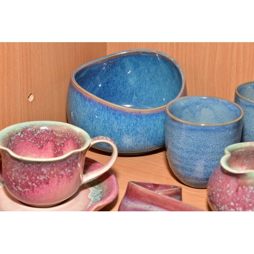 154 - EIGHT PIECES OF STUDIO POTTERY, comprising a tea cup and saucer, matching milk jug, wall pocket, bow... 