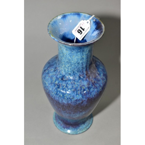 16 - A COBRIDGE STONEWARE HIGH FIRED BALUSTER VASE, with flared rim and foot, mottled and speckled blue g... 