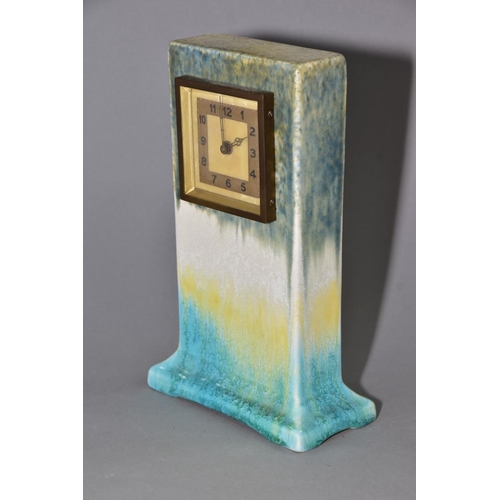 192 - RUSKIN POTTERY, a rectangular clock case with flared base, matt green fading to white and yellow, cr... 