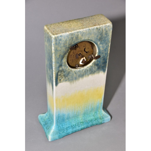 192 - RUSKIN POTTERY, a rectangular clock case with flared base, matt green fading to white and yellow, cr... 