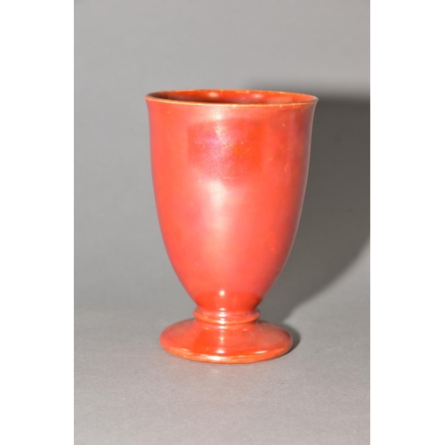 193 - RUSKIN POTTERY, an orange lustre glaze footed goblet, impressed Ruskin England to base, no visible d... 