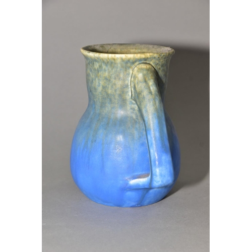 196 - RUSKIN POTTERY, a blue jug of globular to cylindrical form, no spout formed at the rim, impressed Ru... 