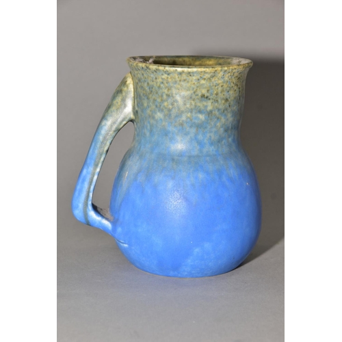 196 - RUSKIN POTTERY, a blue jug of globular to cylindrical form, no spout formed at the rim, impressed Ru... 