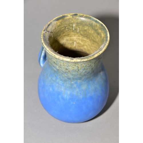 196 - RUSKIN POTTERY, a blue jug of globular to cylindrical form, no spout formed at the rim, impressed Ru... 