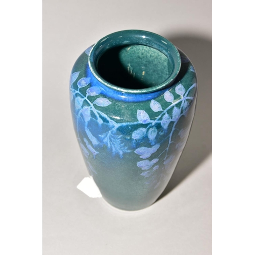 204 - RUSKIN POTTERY, 261 shape vase of high shoulder form, having a dark green mottled glaze with blue un... 