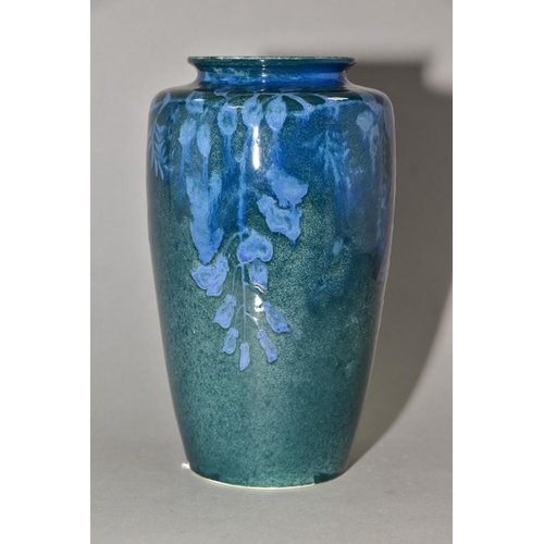 204 - RUSKIN POTTERY, 261 shape vase of high shoulder form, having a dark green mottled glaze with blue un... 