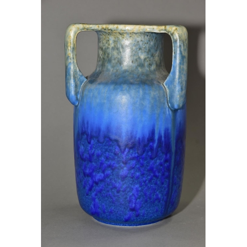 205 - RUSKIN POTTERY, a three handled bottle shaped vase, mottled green fading to blue glaze, inscribed W.... 