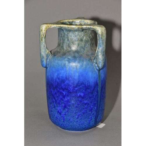 205 - RUSKIN POTTERY, a three handled bottle shaped vase, mottled green fading to blue glaze, inscribed W.... 