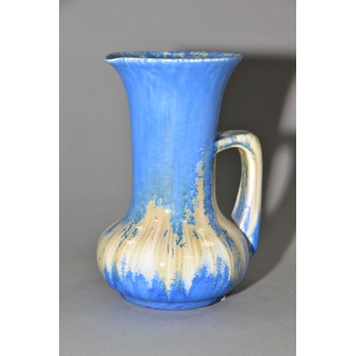 207 - RUSKIN POTTERY, a water jug of onion form, covered in blue crystalline white and cream glazes, impre... 