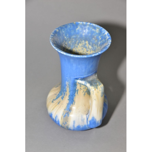 207 - RUSKIN POTTERY, a water jug of onion form, covered in blue crystalline white and cream glazes, impre... 