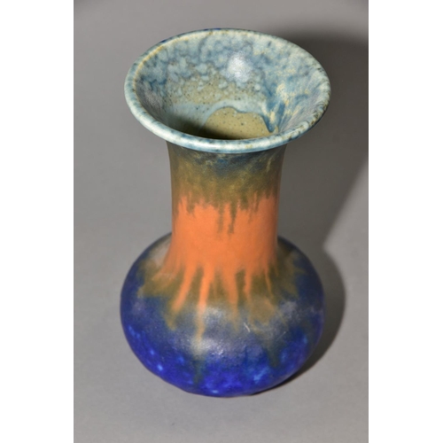 209 - RUSKIN POTTERY, an onion shaped vase covered in bands of green, orange and blue glaze, impressed Rus... 