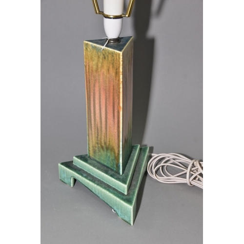 211 - RUSKIN POTTERY, a triangular section moulded lamp base, matt green and orange gloss crystalline glaz... 