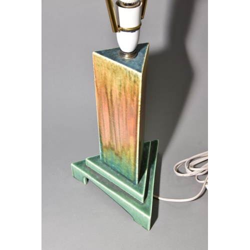 211 - RUSKIN POTTERY, a triangular section moulded lamp base, matt green and orange gloss crystalline glaz... 