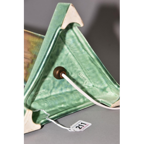 211 - RUSKIN POTTERY, a triangular section moulded lamp base, matt green and orange gloss crystalline glaz... 