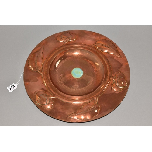 213 - AN ARTS AND CRAFTS STYLE COPPER CHARGER, embossed with a band of foliate motifs, the central dished ... 