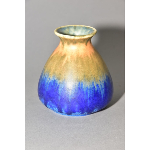 217 - RUSKIN POTTERY, a conical vase with flared rim, bands of orange, green and blue glaze, approximate h... 