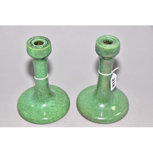 218 - RUSKIN POTTERY, a pair of candlesticks covered in green tea dust glaze, inscribed Ruskin England 192... 