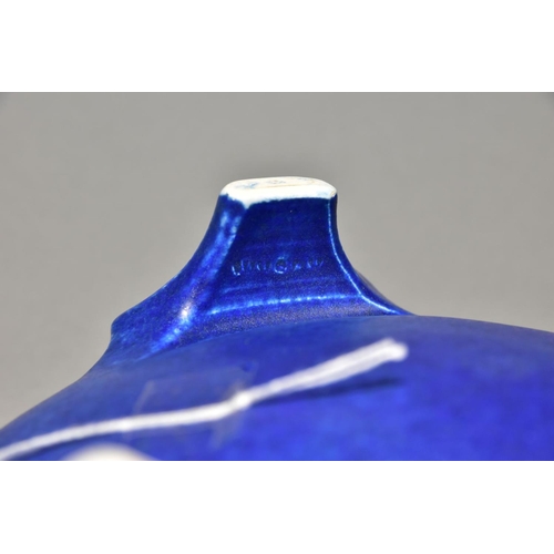 220 - RUSKIN POTTERY a bowl raised on three feet, blue crystalline glaze to the inside surface, impressed ... 