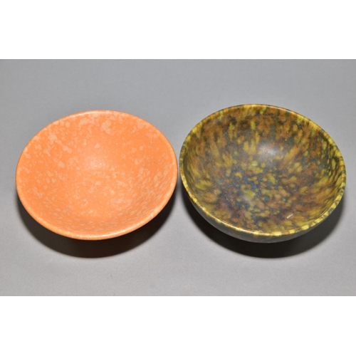 221 - RUSKIN POTTERY, two footed bowls of mottled glazes, the first is orange and is impressed Ruskin Engl... 