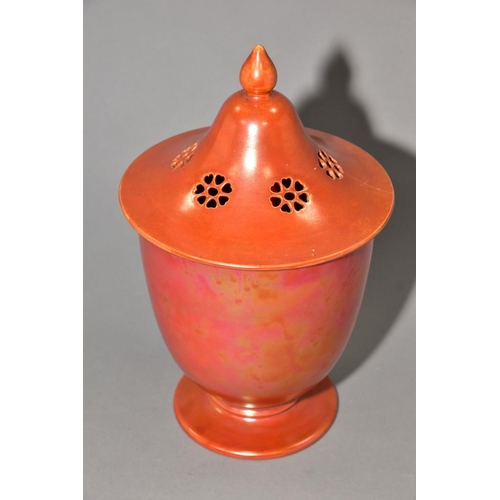 224 - RUSKIN POTTERY, a large orange lustre pot pourri jar with cover, the jar has a ringed foot, impresse... 