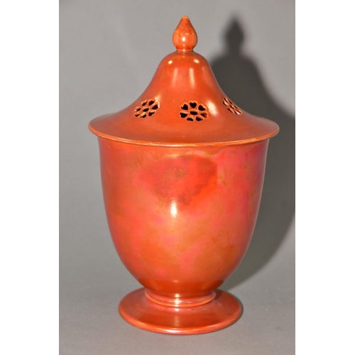 224 - RUSKIN POTTERY, a large orange lustre pot pourri jar with cover, the jar has a ringed foot, impresse... 