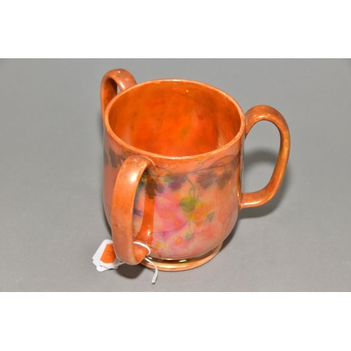 227 - RUSKIN POTTERY, a three handled tyg decorated in orange lustre with a band of underglazed foliate de... 