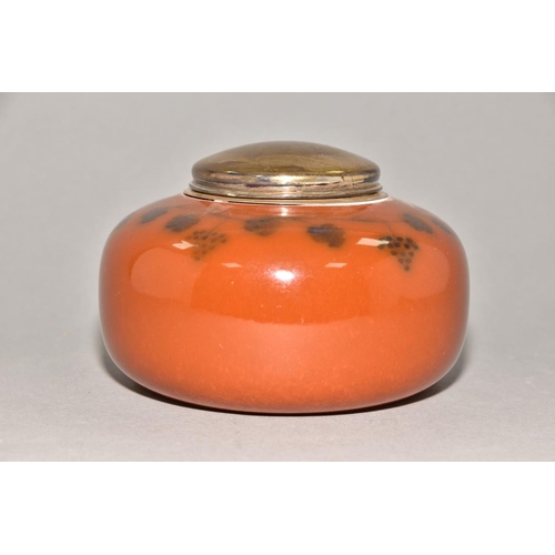 228 - RUSKIN POTTERY, a storage jar of compressed oval form with metal collar and lid, brown high gloss gl... 