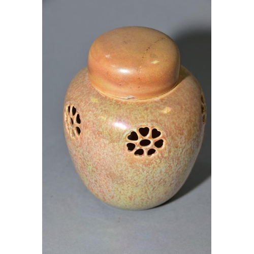 232 - RUSKIN POTTERY, a peach lustre reticulated ginger/pot pourri jar with cover, the body pierced with f... 