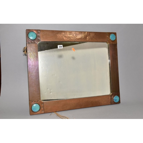 235 - AN ARTS & CRAFT STYLE RECTANGULAR COPPER FRAMED MIRROR, inset with four Ruskin style circular plaque... 