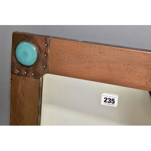 235 - AN ARTS & CRAFT STYLE RECTANGULAR COPPER FRAMED MIRROR, inset with four Ruskin style circular plaque... 