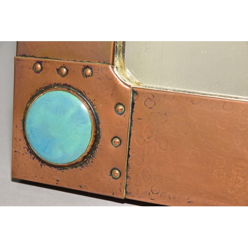 235 - AN ARTS & CRAFT STYLE RECTANGULAR COPPER FRAMED MIRROR, inset with four Ruskin style circular plaque... 