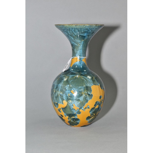 26 - A SIMON RICH (BORN 1949) STUDIO POTTERY CRYSTALLINE GLAZED BOTTLE VASE, wide flared rim, ochre groun... 