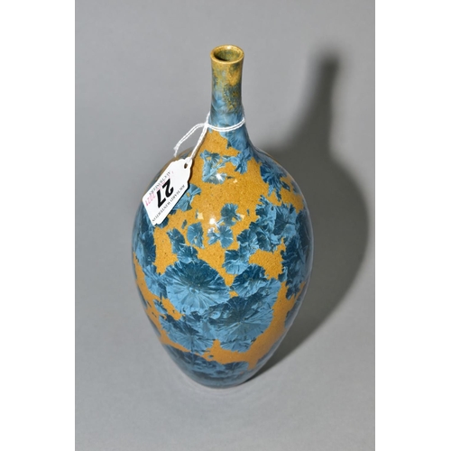 27 - A SIMON RICH (BORN 1949) STUDIO POTTERY CRYSTALLINE GLAZED OVOID BOTTLE VASE, ochre ground with blue... 