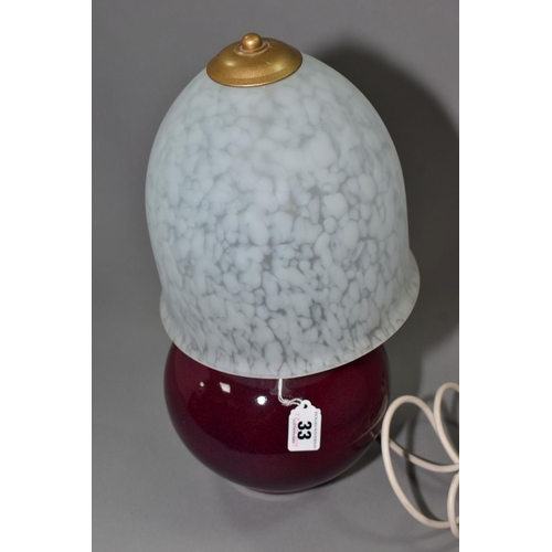 33 - A STUDIO POTTERY TABLE LAMP PROBABLY BY DARTINGTON POTTERY, globular form, with a high fired speckle... 