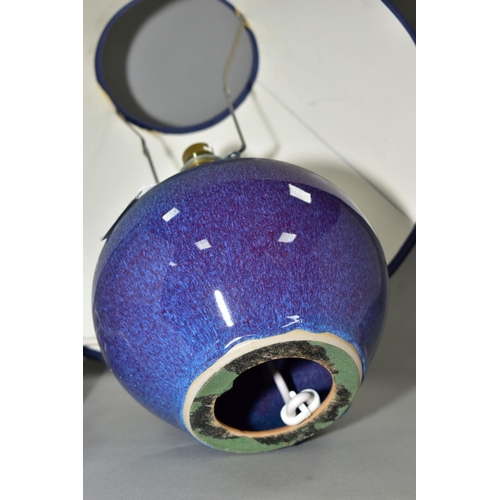 34 - A DARTINGTON POTTERY TABLE LAMP, of globular form, with a high fired mottled blue glaze, impressed s... 