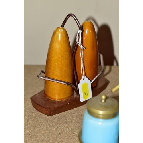 37 - A COLLECTION OF NOVELTY AND OTHER CERAMIC CRUETS AND TOAST RACKS, including a Swedish teak and turqu... 