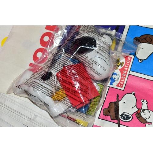 50 - A BOX OF MCDONALDS SNOOPY/PEANUTS 50 CELEBRATION HAPPY MEAL TOYS, ETC, comprising twelve Snoopy toys... 