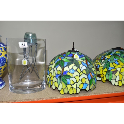 54 - A GROUP OF LAMP BASES, GLASS LIGHT SHADES, CANDLE HOLDERS, etc, comprising two coloured leaded glass... 