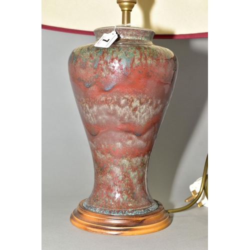 7 - A COBRIDGE STONEWARE HIGH FIRED BALUSTER TABLE LAMP, mottled green/blue glaze over a red ground, mou... 