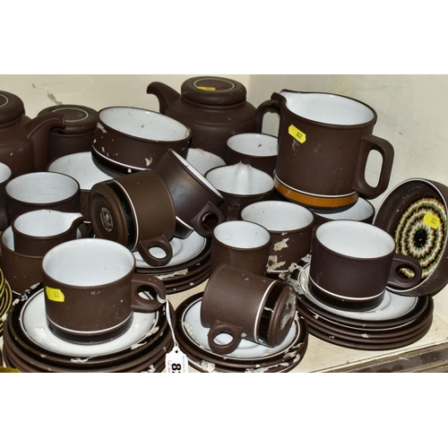 82 - A QUANTITY OF HORNSEA CONTRAST PATTERN TEA WARES, including two teapots, a large jug, cups, saucers ... 