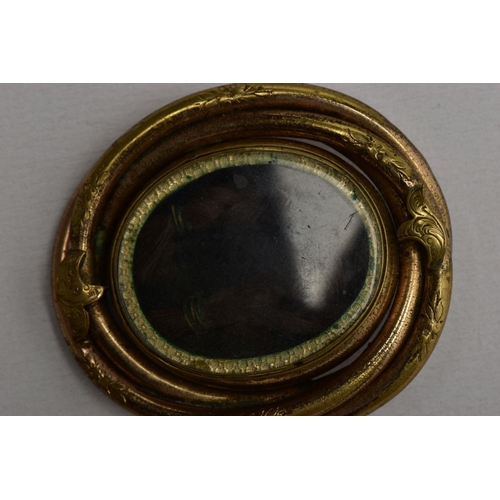 114 - THREE ITEMS OF VICTORIAN JEWELLERY, to include an oval memorial brooch with central double sided swi... 